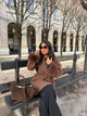 Women's brown long coat with tie belt and fur cuffs