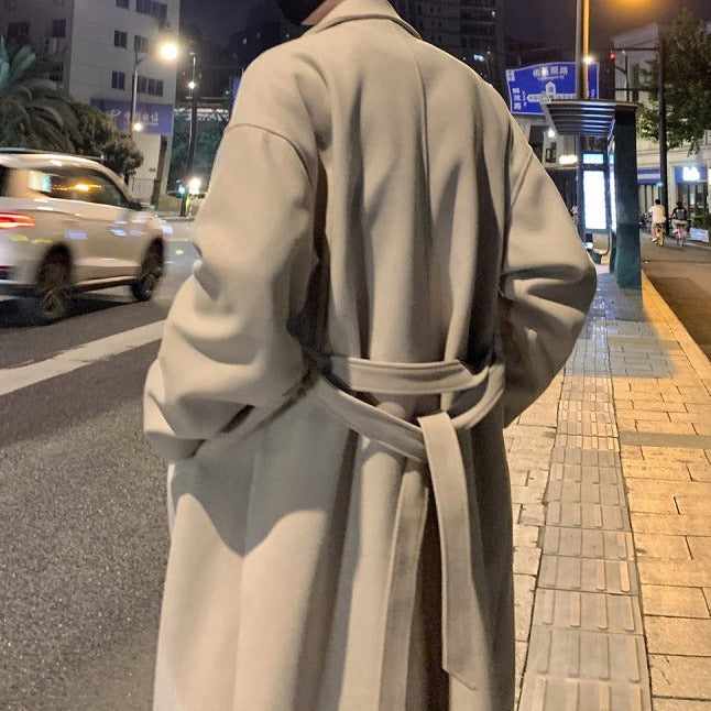 Longline belted overcoat with notch lapels and side pockets