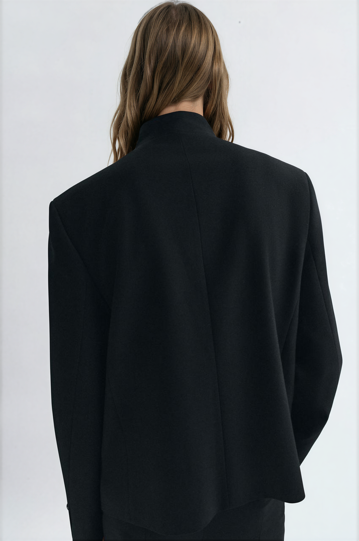 Women's collarless button blazer with long sleeves and front pockets