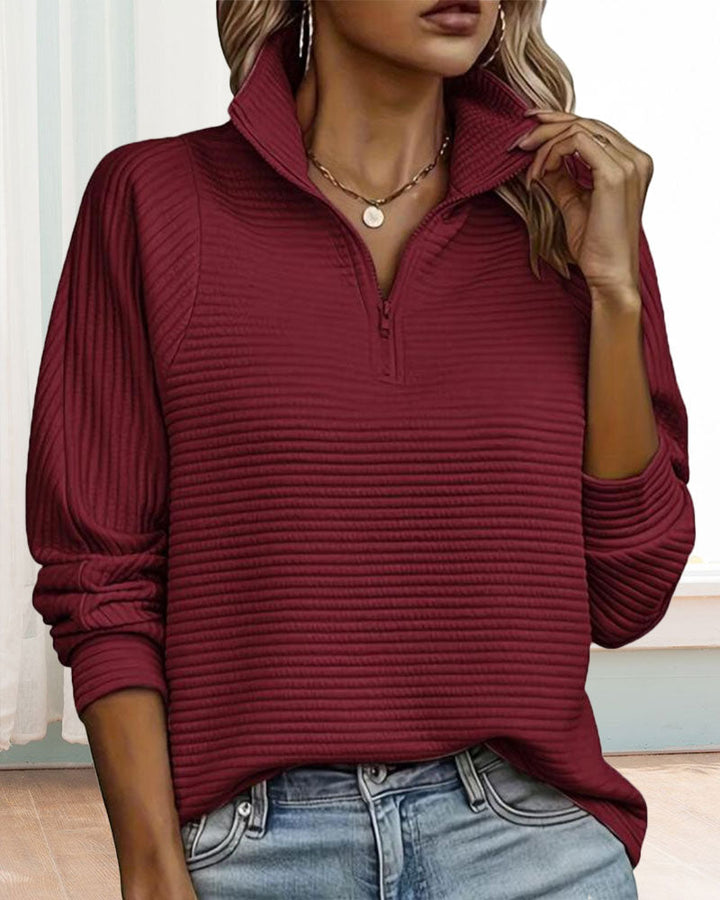 Women's textured quarter-zip sweatshirt with a high mock neck and long sleeves