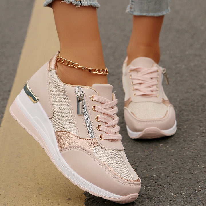 Women's silver metallic platform sneaker with lace-up front, side zip, and chunky white sole