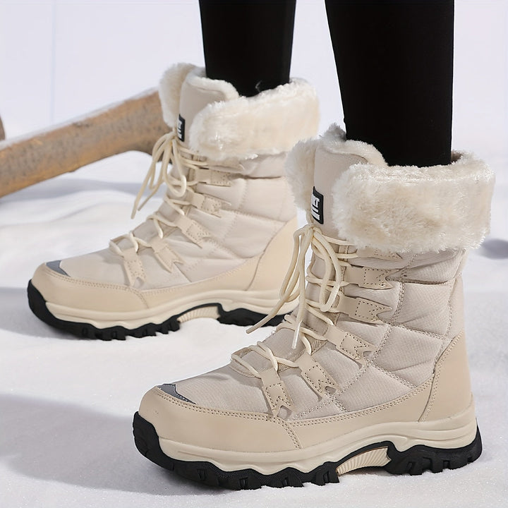 Women's lace-up winter boots with faux-fur cuffs and lug soles