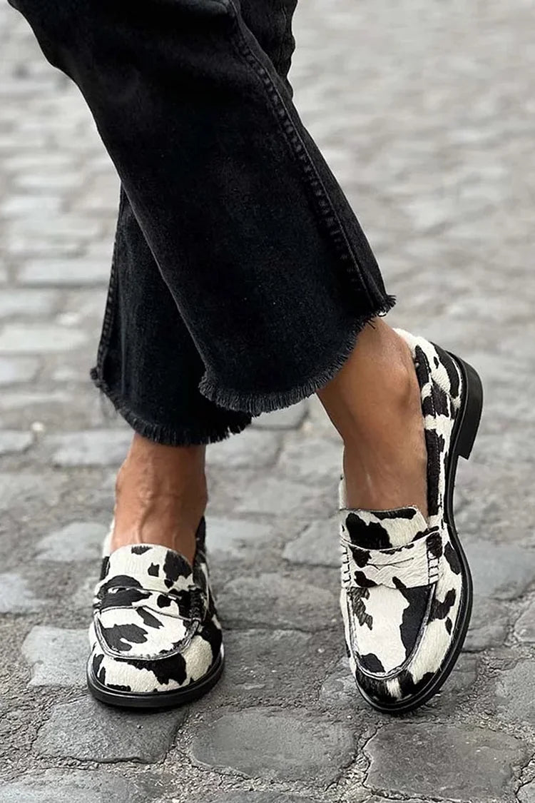 Women's white and black cow print round toe loafers