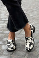 Women's white and black cow print round toe loafers