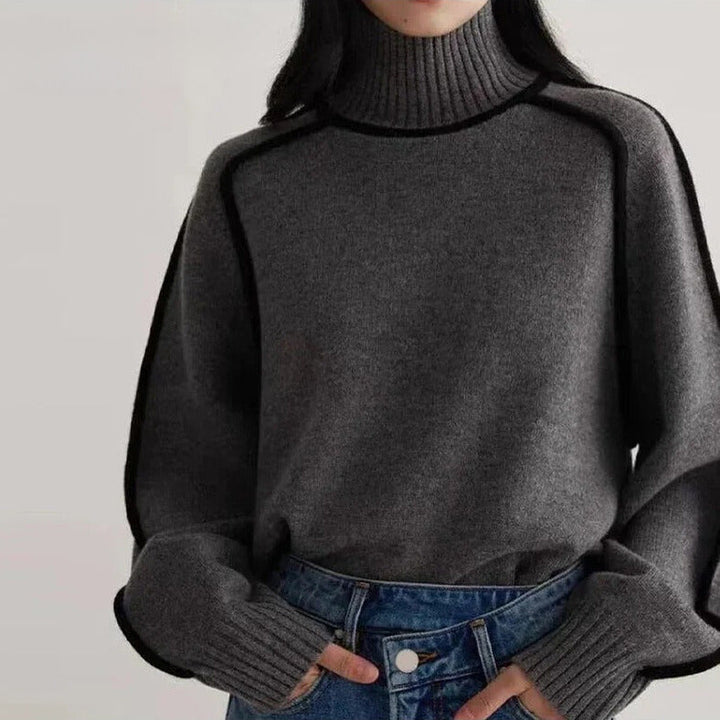 Women's turtleneck sweater with black contrast piping and long sleeves