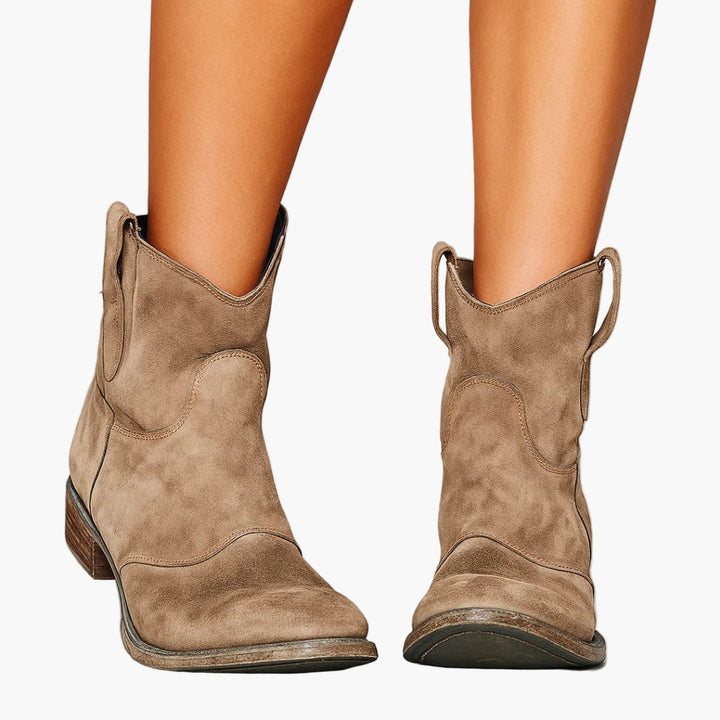 Women's western boots with pull tabs and stitched panels