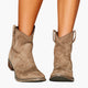 Women's western boots with pull tabs and stitched panels