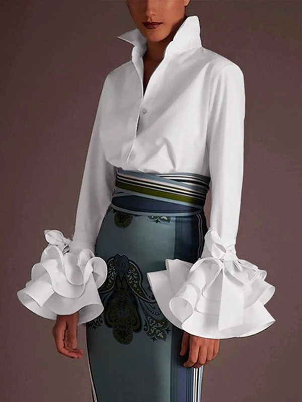 Women's solid blouse with raised collar, long sleeves, bow details and layered ruffle cuffs
