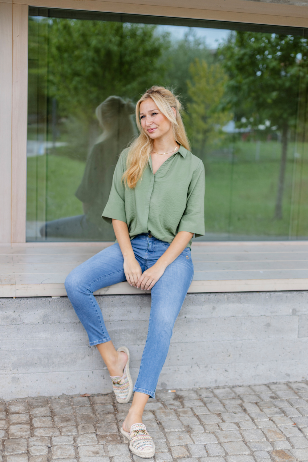 Women's light blue slim fit jeans with low-rise waist and star pocket detail