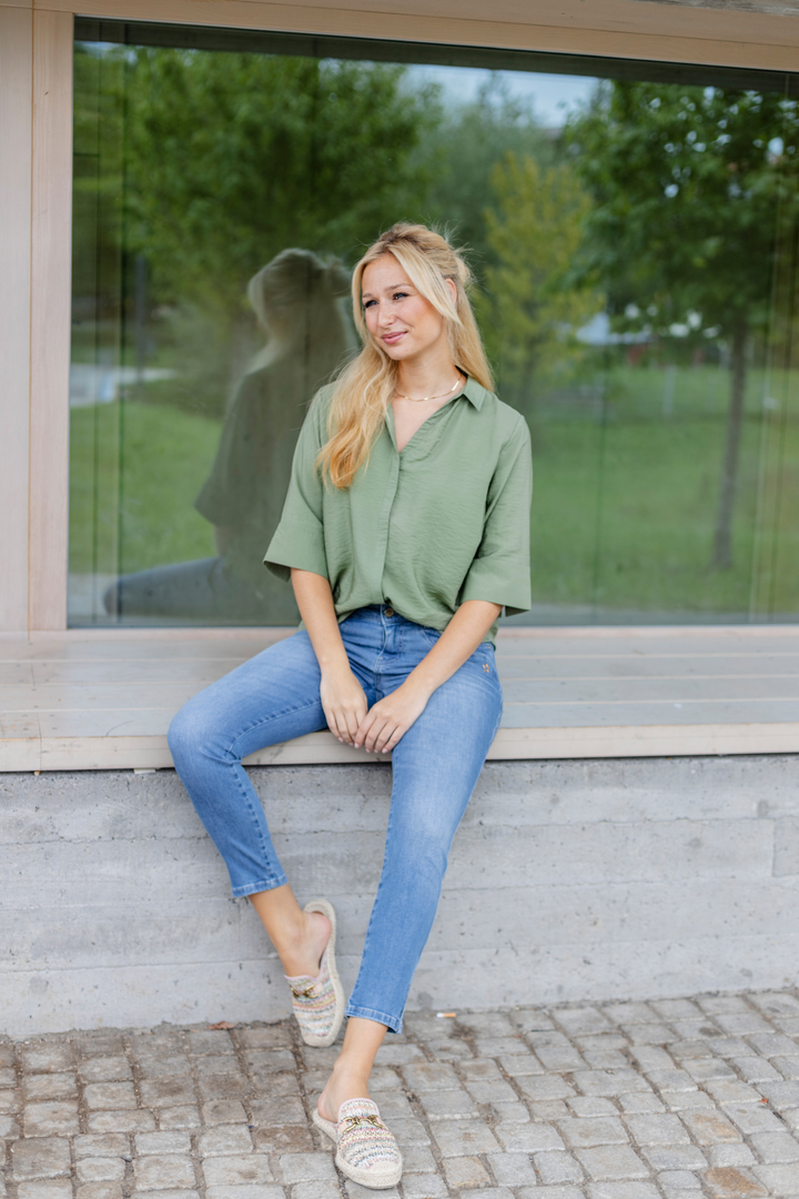 Women's light blue slim fit jeans with low-rise waist and star pocket detail