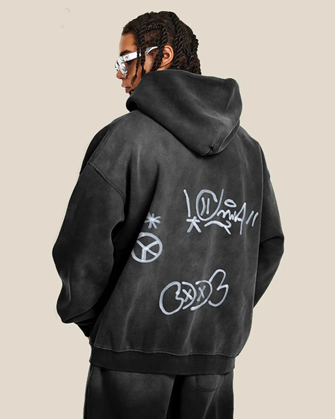 Washed zip-up hoodie with graffiti-style lettering and front pockets