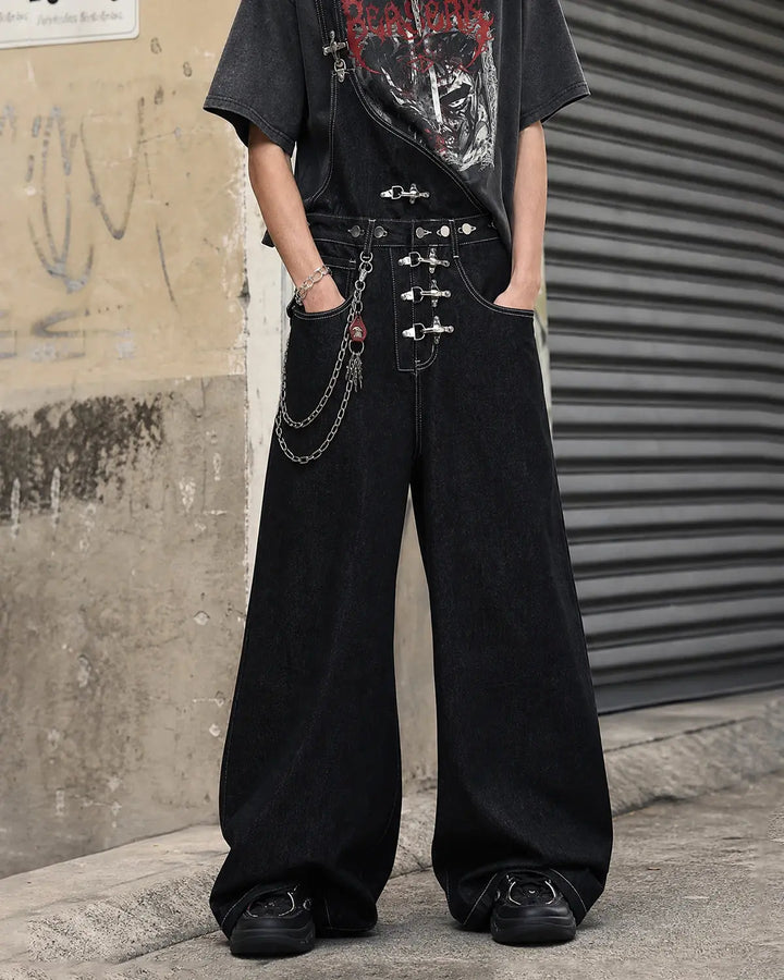 Black asymmetric denim overalls with buckle details and wide legs