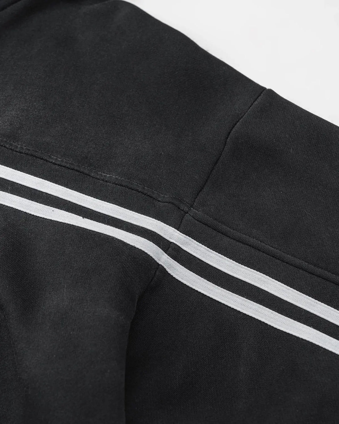 Men's black zip-up hoodie with white chest and sleeve stripes