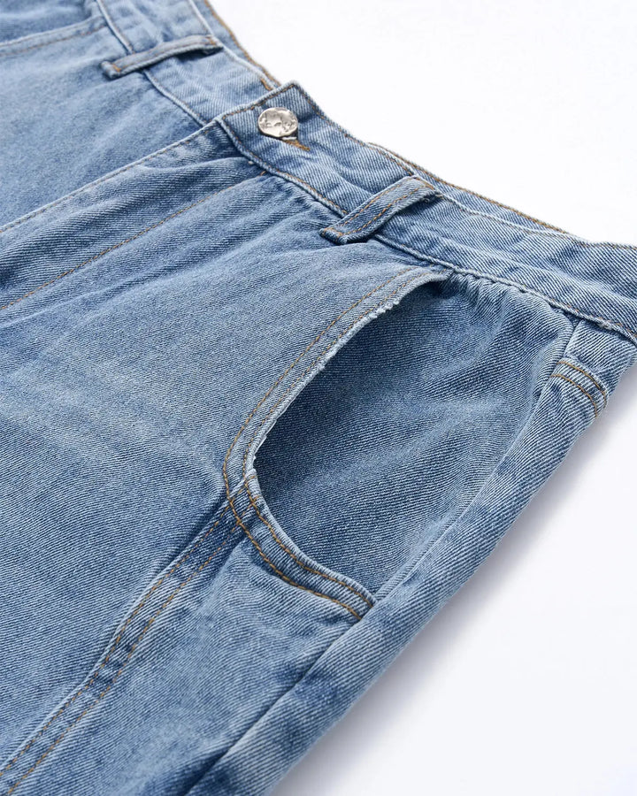 Light blue barrel jeans with dark script graphic on one leg