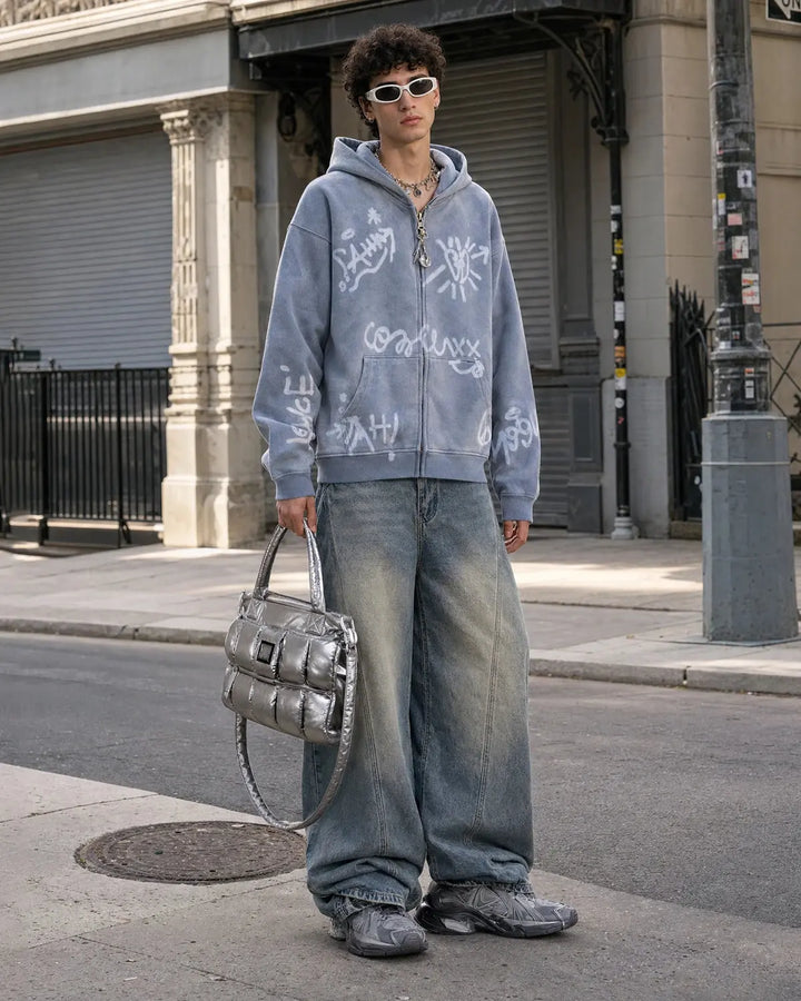 Washed zip-up hoodie with graffiti-style lettering and front pockets