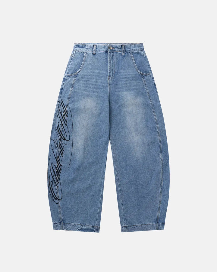 Light blue barrel jeans with dark script graphic on one leg