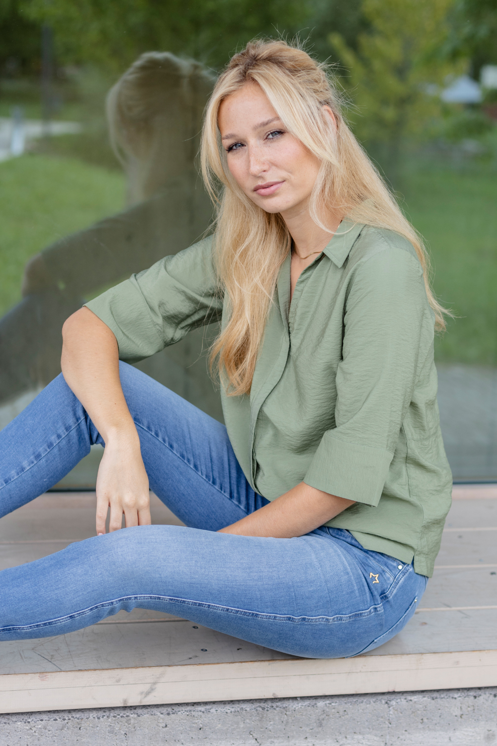 Women's light blue slim fit jeans with low-rise waist and star pocket detail