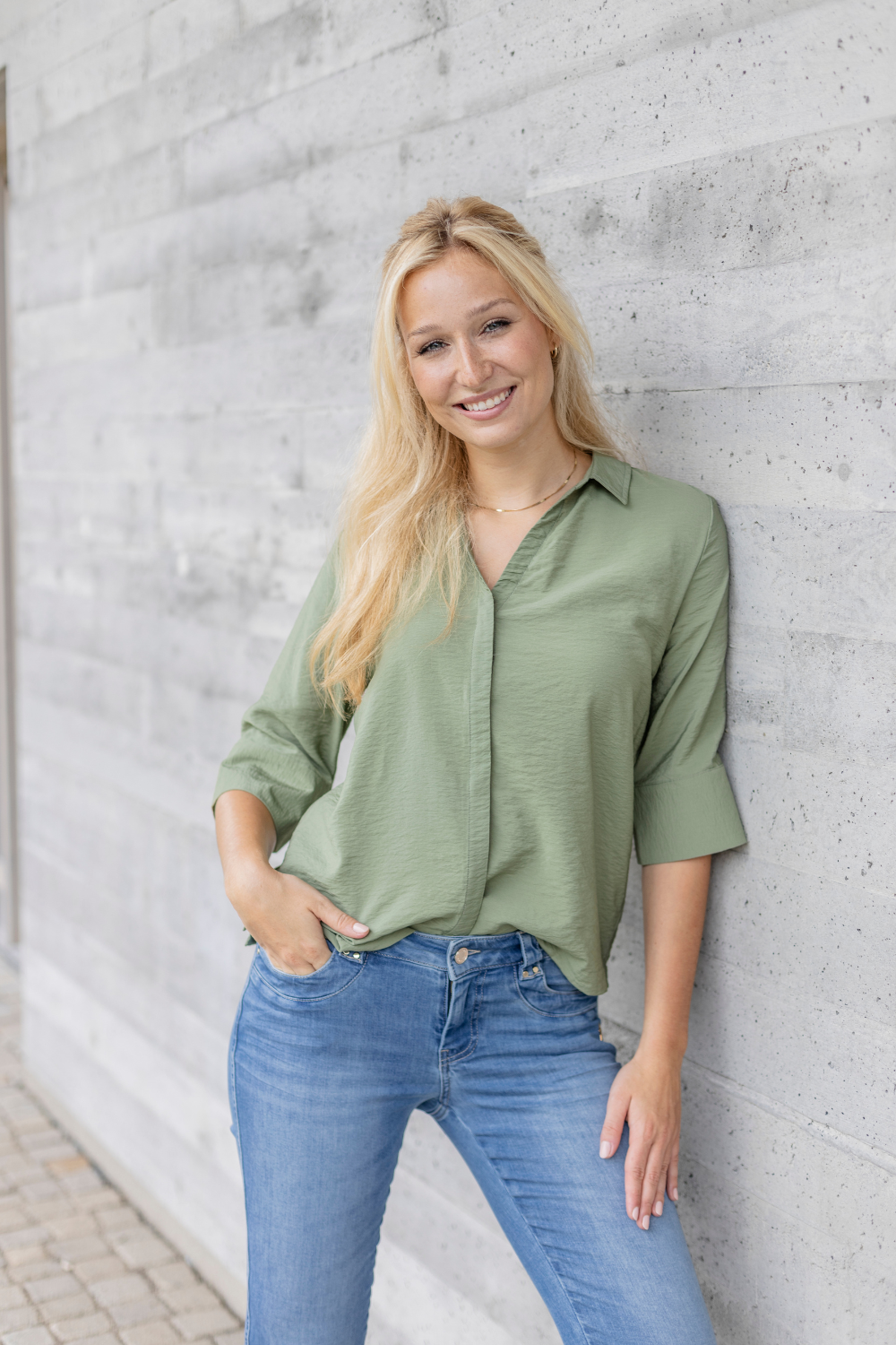 Women's light blue slim fit jeans with low-rise waist and star pocket detail