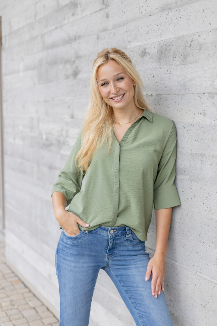 Women's light blue slim fit jeans with low-rise waist and star pocket detail