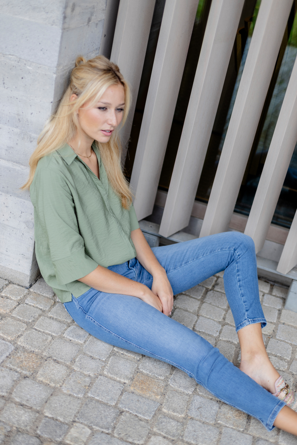 Women's light blue slim fit jeans with low-rise waist and star pocket detail
