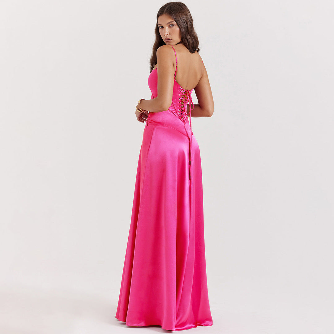Women's black maxi dress with cowl neckline and cami straps, showing full-length floor skirt and back tie detail