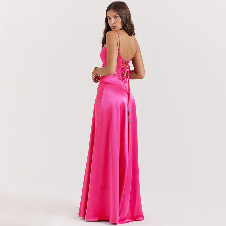 Women's black maxi dress with cowl neckline and cami straps, showing full-length floor skirt and back tie detail
