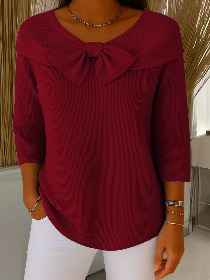 Women's ribbed sweater with large front bow and three-quarter sleeves