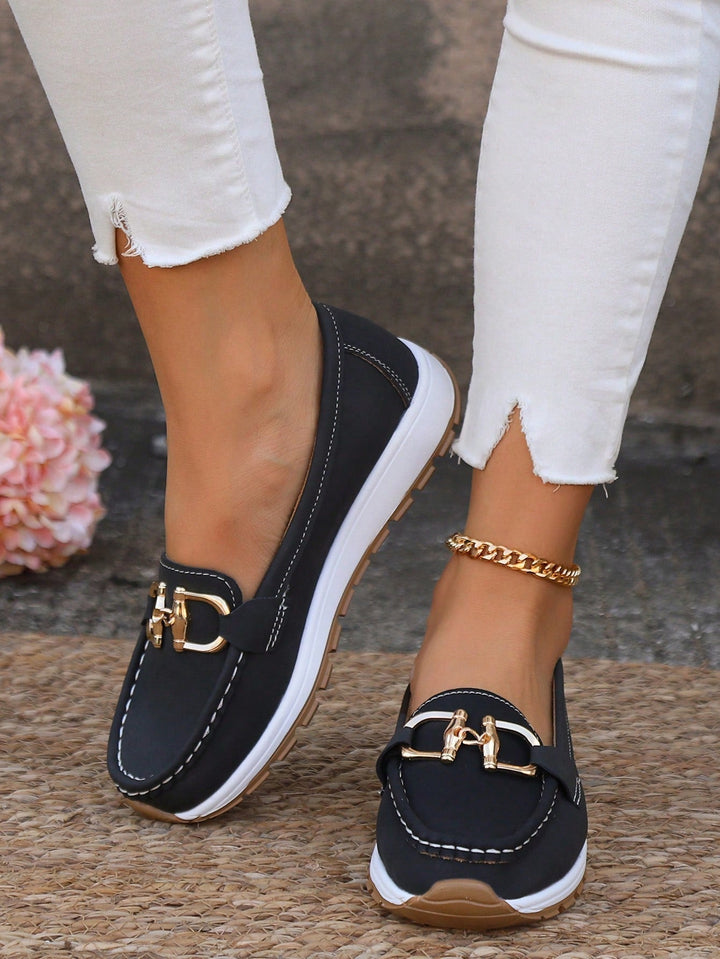 Women's buckle loafers with moc toe and flat textured sole