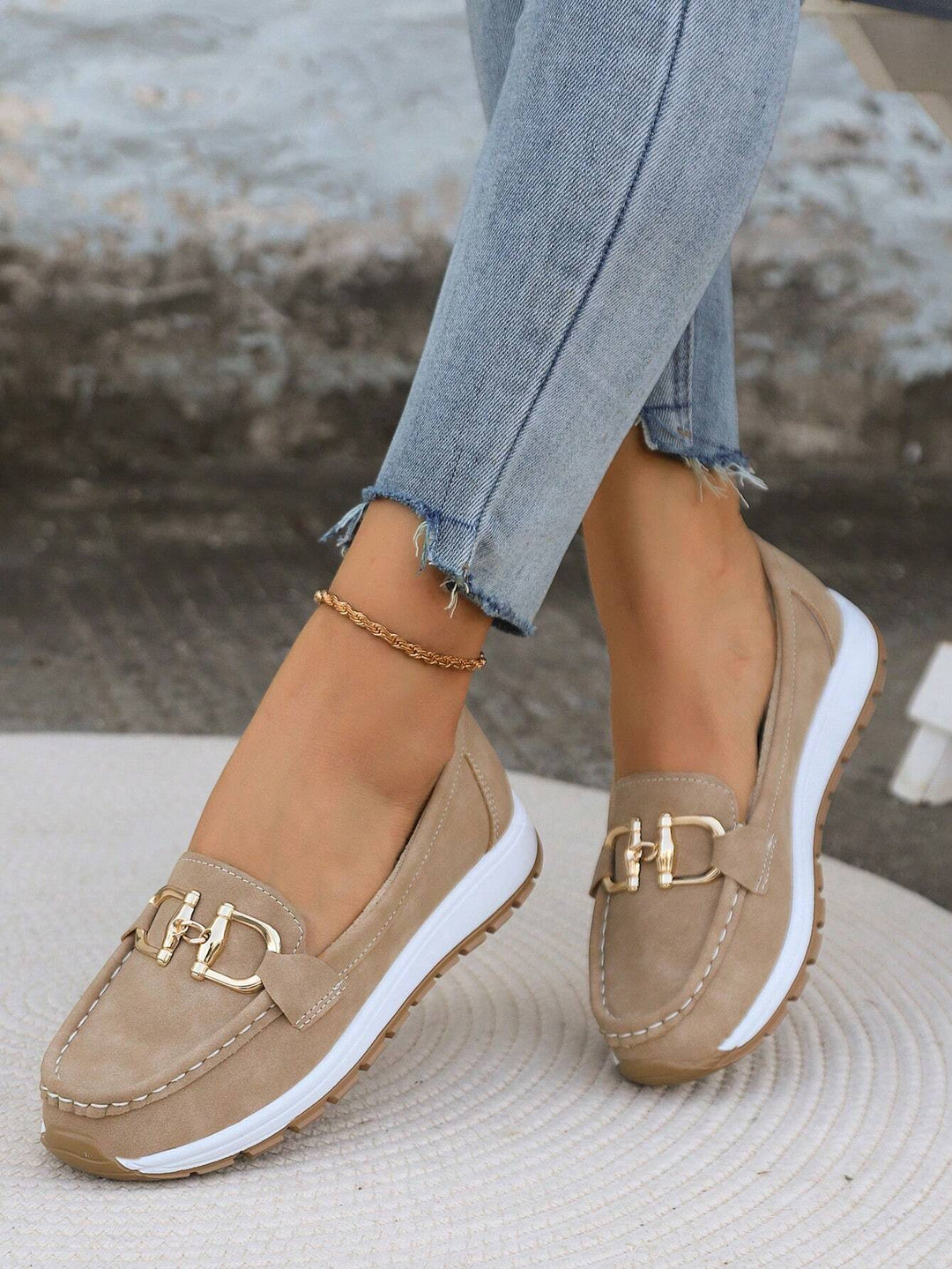 Women's buckle loafers with moc toe and flat textured sole