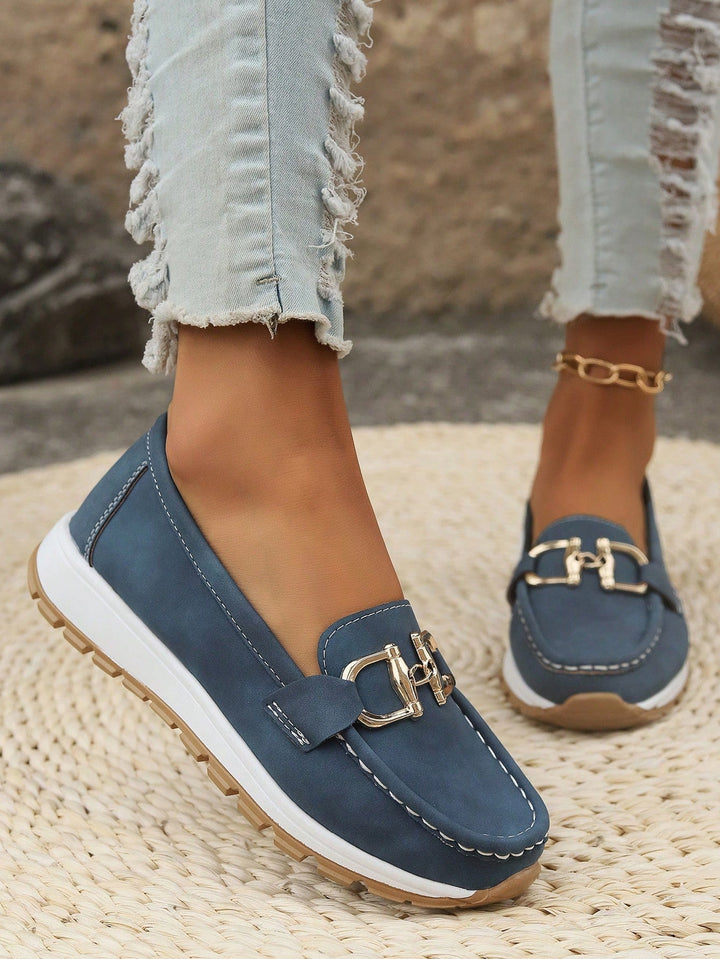 Women's buckle loafers with moc toe and flat textured sole