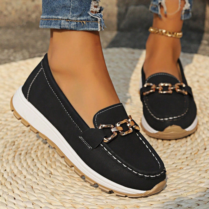 Women's flat loafers with metal buckle detail and round toes