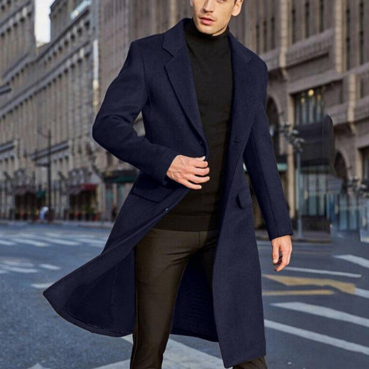 Men's long tailored coat with notched lapels and flap pockets