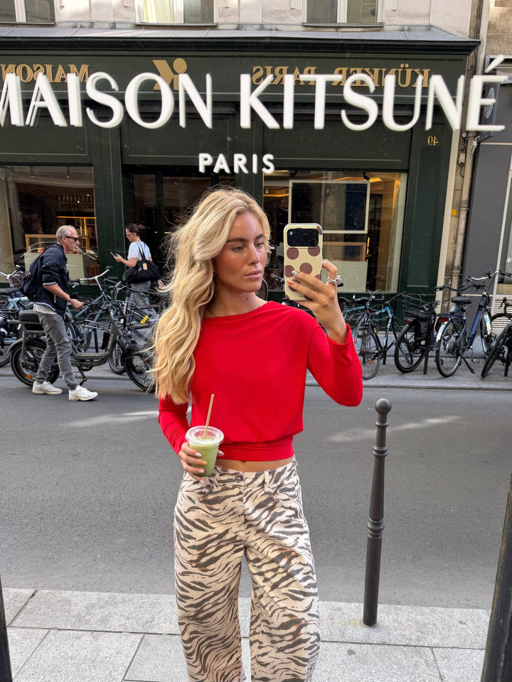 Women's red cropped sweater with wide neckline and long sleeves
