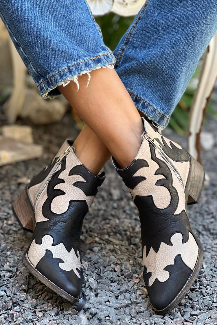 Black and cream patterned cutout ankle boots with pointed toes and low block heels