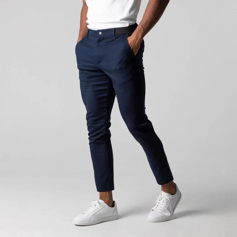Men's slim tapered chino trousers with button fastening and ankle-length hems