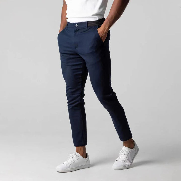 Men's slim tapered chino trousers with button fastening and ankle-length hems