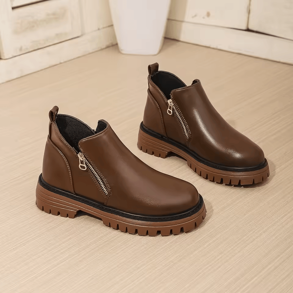 Women's platform ankle boots with side zippers and chunky lug soles