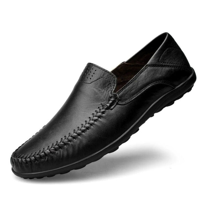 Men's slip-on loafers with stitched front detail and flat textured soles