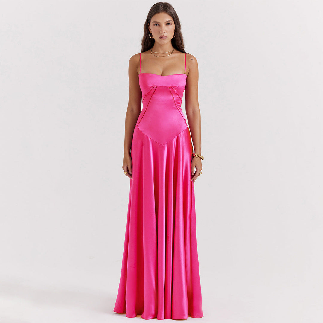 Women's black maxi dress with cowl neckline and cami straps, showing full-length floor skirt and back tie detail