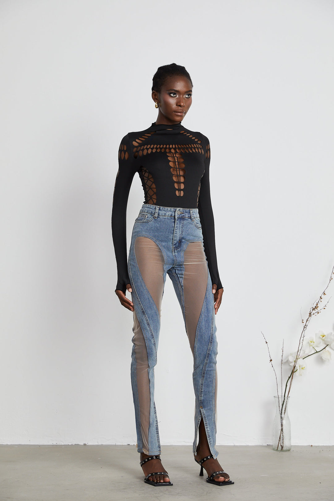 Women's blue high-rise jeans with sheer leg panels