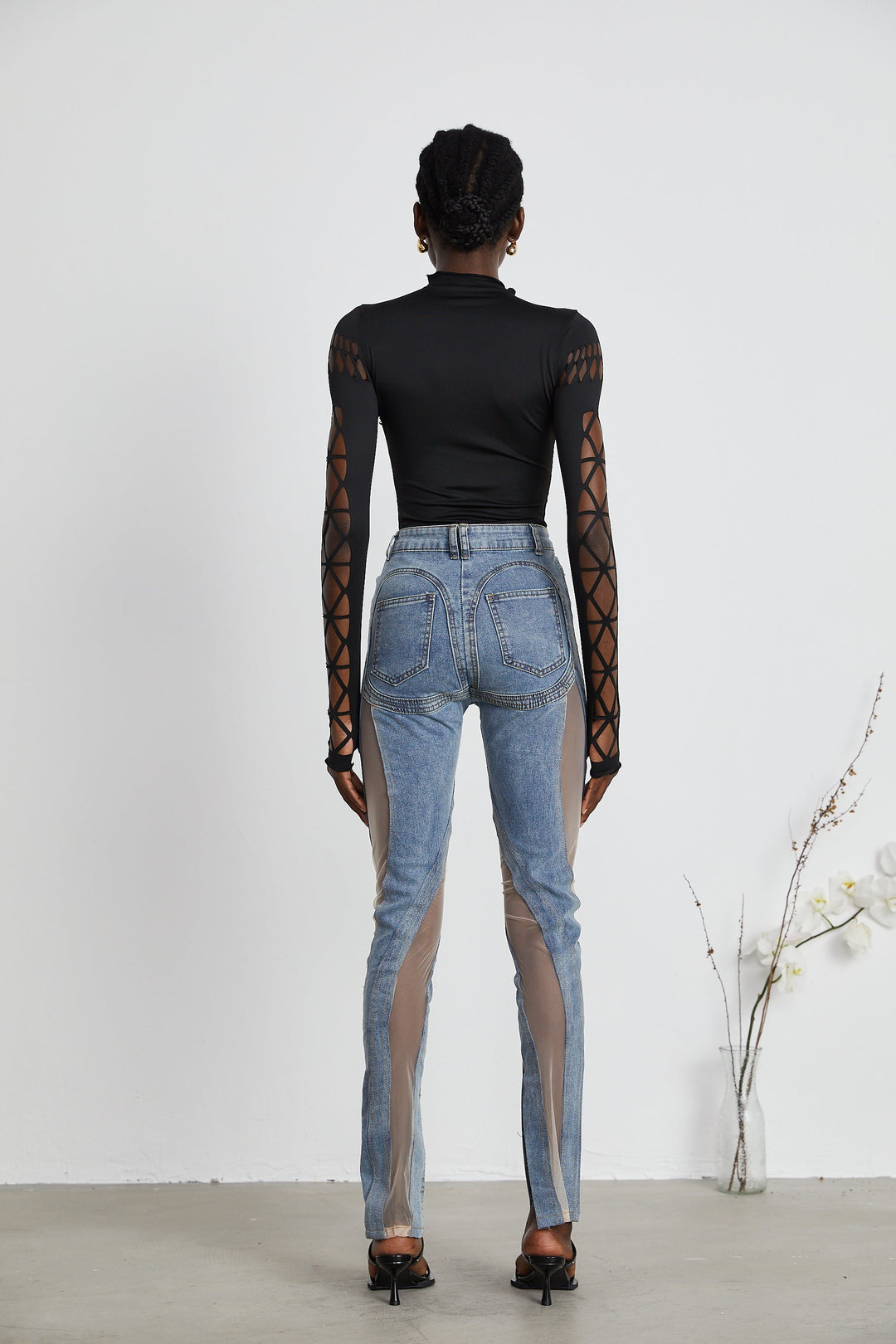 Women's blue high-rise jeans with sheer leg panels