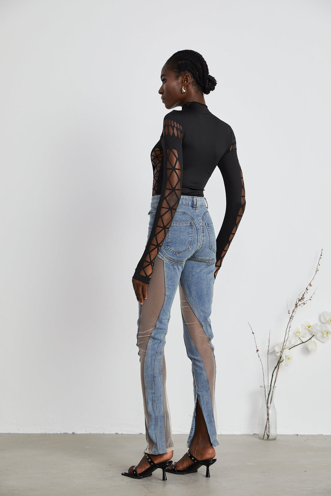 Women's blue high-rise jeans with sheer leg panels