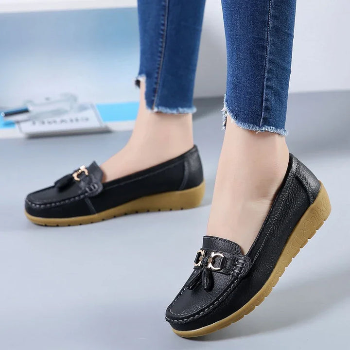 Women's slip-on loafers with tassel and metal details