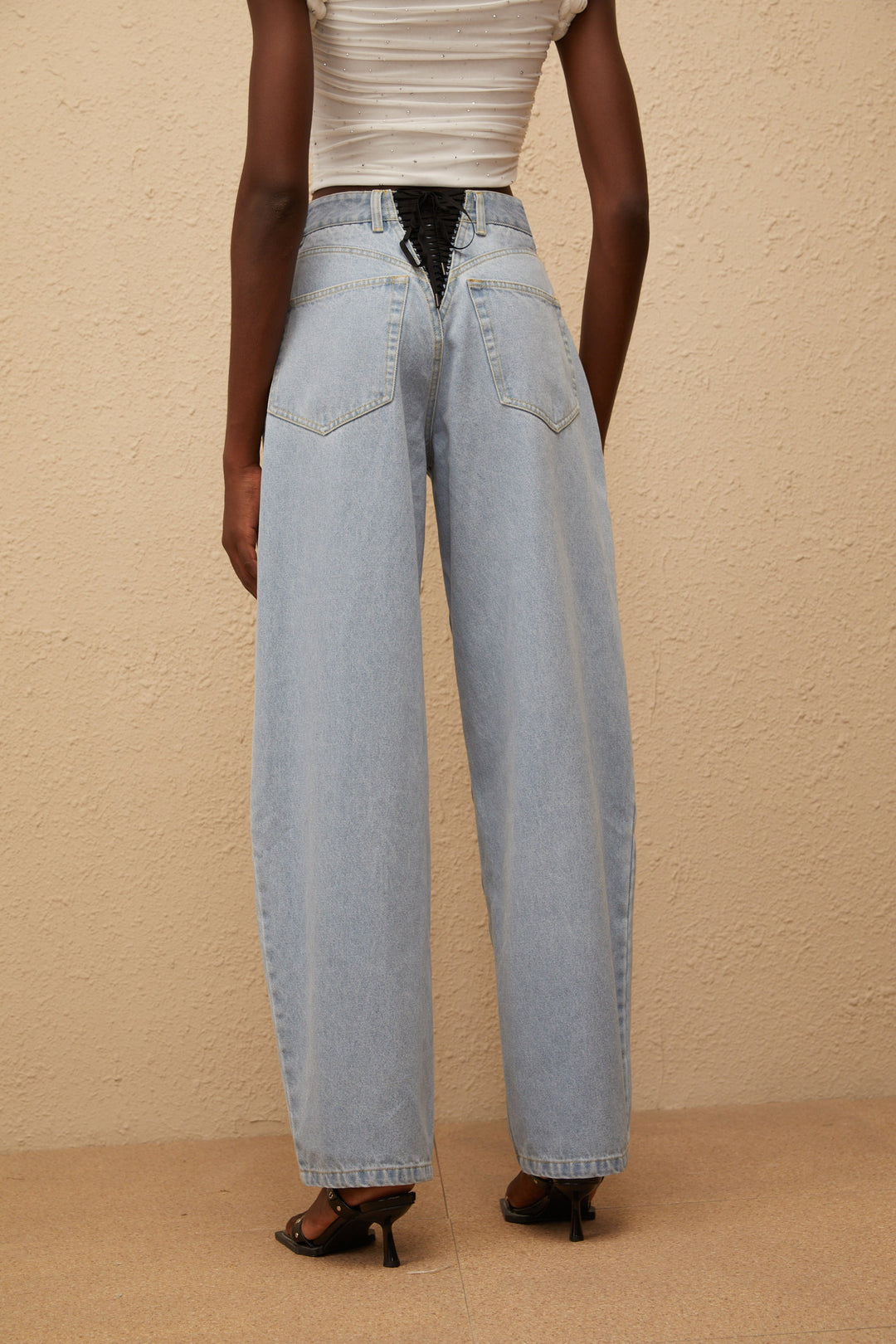 Women's light blue high-rise wide leg jeans with front and rear pockets