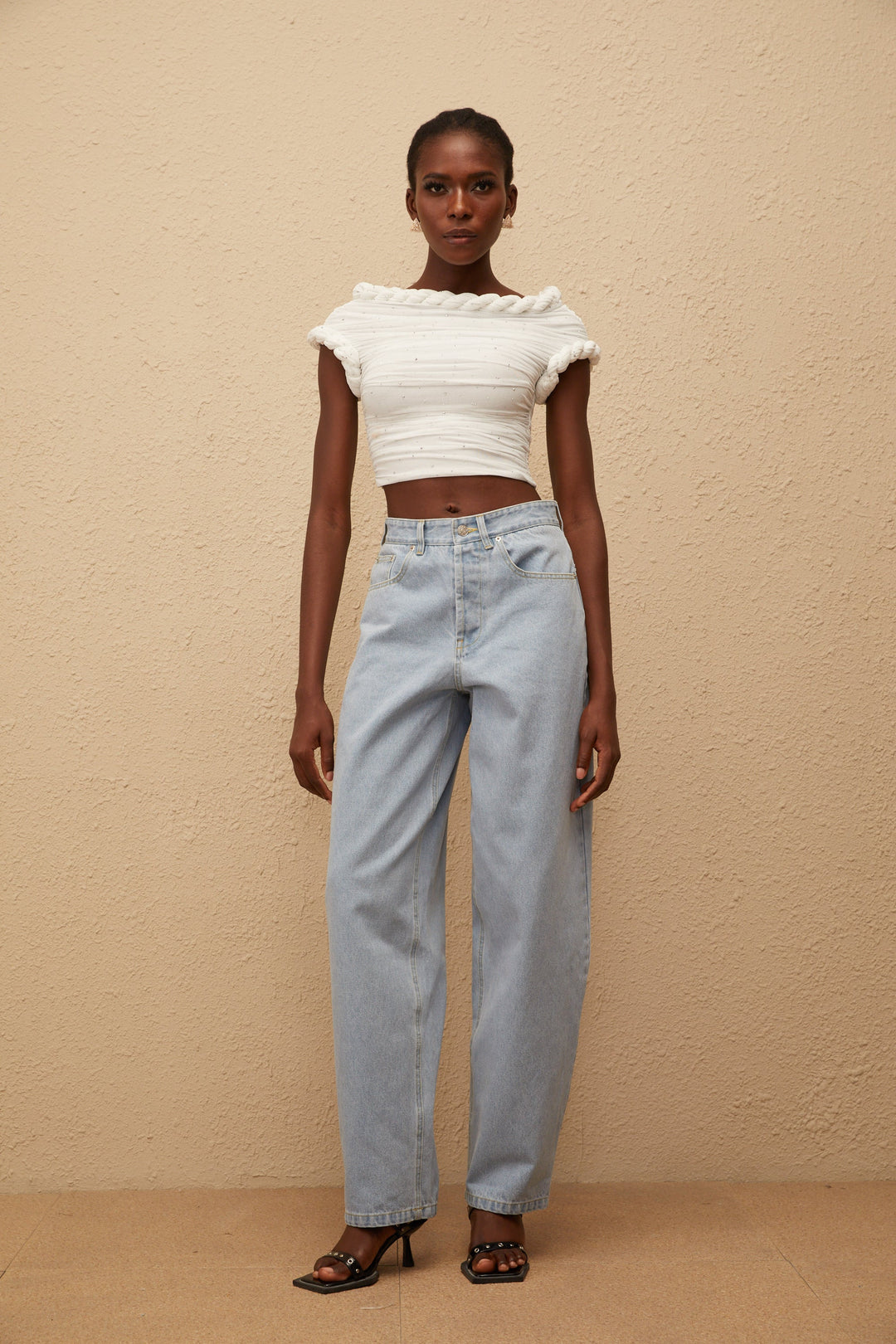 Women's light blue high-rise wide leg jeans with front and rear pockets