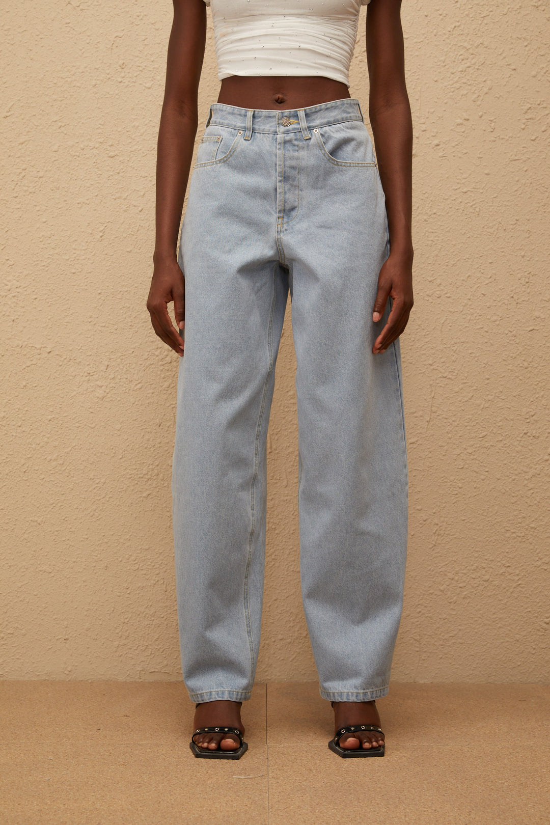 Women's light blue high-rise wide leg jeans with front and rear pockets
