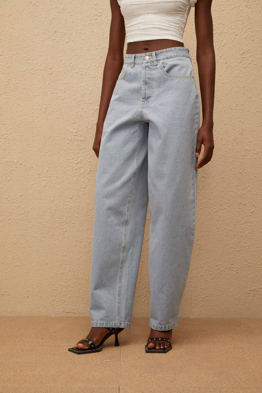 Women's light blue high-rise wide leg jeans with front and rear pockets