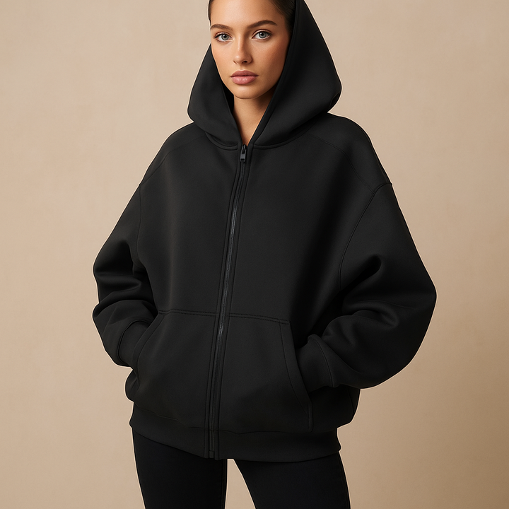 Women's oversized zip-up hooded sweatshirt with long sleeves and front pockets