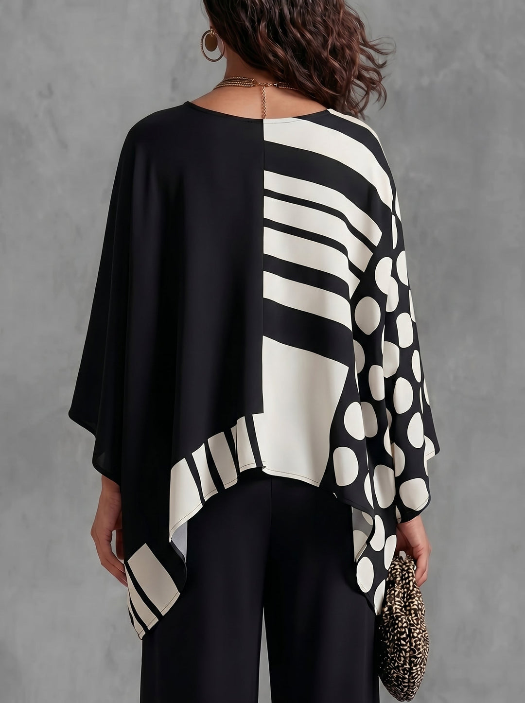 Women's oversized batwing sleeve top with polka-dot print in black and white, and green and white versions