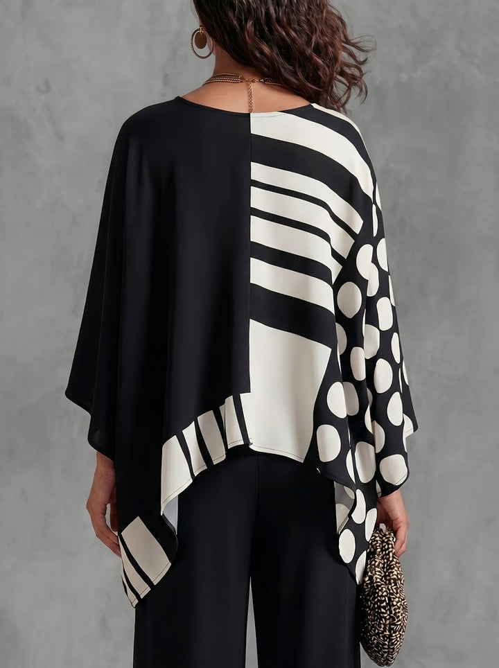 Women's oversized batwing sleeve top with polka-dot print in black and white, and green and white versions